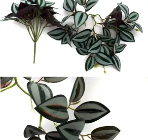 Artificial green plant hanging vine with watermelon stripe leaves, ideal for indoor wall decor.