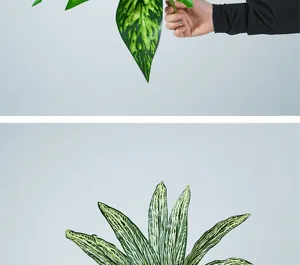 Artificial green plant leaf detail, realistic striped design for floral arrangements.