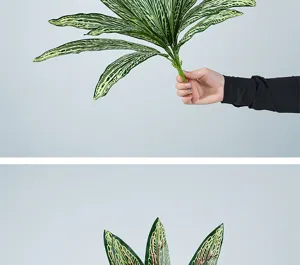 Detail view of artificial striped green plant leaves for floral arrangement and home decor.