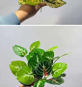 Detalle de hoja de planta verde artificial, follaje realista para hermosa decoración.