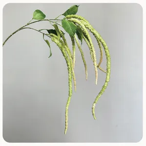 Detail view of artificial hanging flower branch with long green cascading tassel for home decor.