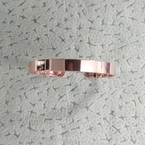 Close-up detail of women's adjustable magnetic copper cuff bracelet with polished rose gold finish.