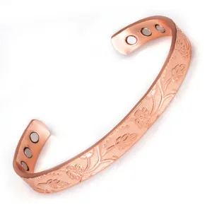 Bracciale rigido aperto magnetico in rame puro con motivo floreale in rilievo unico