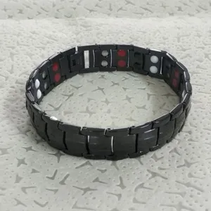 Black magnetic health bracelet for men and women, stylish titanium steel link wristband.