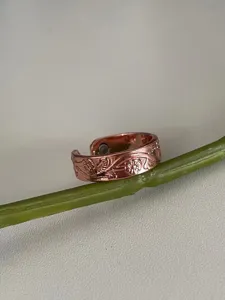 Adjustable flower copper magnetic ring 6mm wide, exquisite floral embossed design.