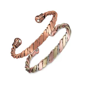 Detailed close-up of handmade twisted magnetic copper and multi-color metal open cuff bracelets.