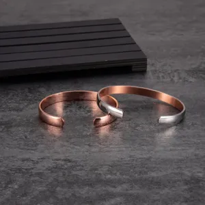 Detailed close-up view of adjustable magnetic copper cuff bracelets featuring fine metallic finish.