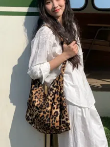 Stylish leopard print canvas shoulder tote bag, casual large capacity daily handbag.