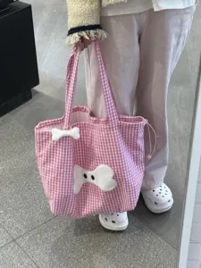 Korean style pink plaid canvas tote bag with cute bone plush patch for women, large capacity.