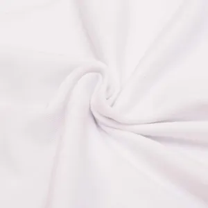 Detailed close-up of white fabric texture showing soft quality material for apparel items.
