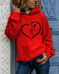 Detailed view of casual red hoodie with cute cat heart graphic print, comfortable long sleeve.