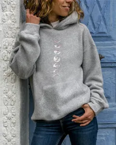 Detailed shot of a women's grey hooded sweatshirt featuring a stylish moon phase print.