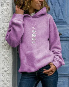 Detail shot of a women's casual purple hoodie featuring a moon phase graphic print and pocket.