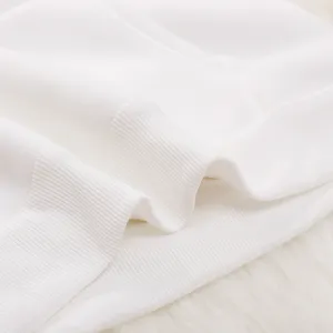 White hoodie cuff fabric detail close up, premium ribbed cotton texture product shot