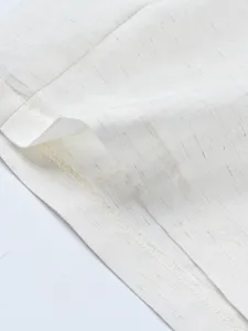 Detailed view of comfortable men's casual shirt and shorts set fabric texture and clean stitching.