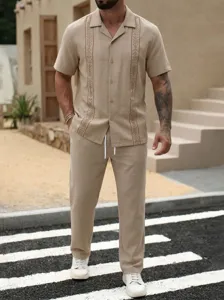 Men casual khaki short sleeve shirt and trousers set featuring stylish embroidery details.