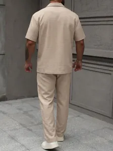 Men's casual short sleeve button shirt and matching trousers two piece linen style outfit.