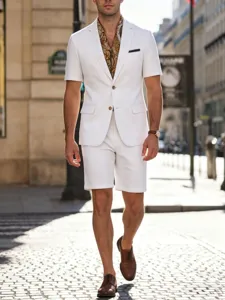 Men's short-sleeve white suit detail view showcasing casual summer menswear style outdoors.