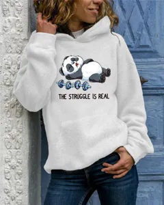 Close-up detail of the cozy light grey hoodie showcasing a cute cartoon panda print.