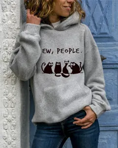 Close-up detail view of gray hooded sweatshirt with cute cat graphic and text print style.