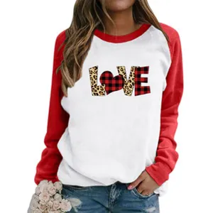 Detail view of the casual long sleeve sweatshirt featuring a lovely plaid chest print design.