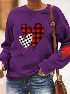 Purple fleece-lined sweatshirt featuring a plaid heart print and elbow patch detail.