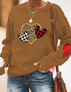 Brown long sleeve sweatshirt featuring heart graphic prints, cozy pullover with elbow patches.