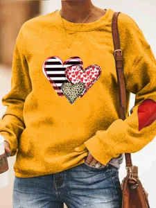 Lässiges gelbes Damen Sweatshirt langarm mit Herz-Print und süßen Ellenbogen-Patches.