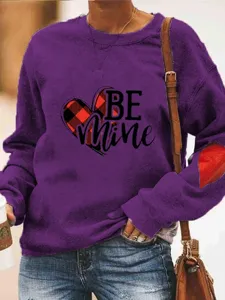 Valentine's Day women's purple crewneck long sleeve sweatshirt with heart print and elbow patch.