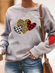 Casual grey long sleeve crewneck sweatshirt with cute heart prints and cozy fleece lining.