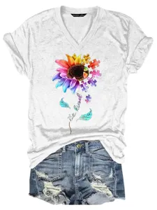 Detailed view of women's short sleeve V-neck t-shirt with colorful puzzle sunflower graphic.