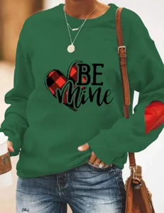 Women casual green long sleeve sweatshirt with Valentine Day heart print and elbow patch detail.