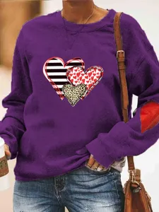 Bequemes Damen Freizeit Langarm Sweatshirt mit herzigem Print und praktischen Flicken.
