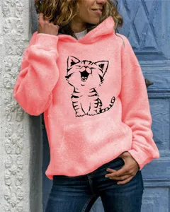 Close-up detail shot of a cute pink cat print hoodie featuring long sleeves and comfy hood.