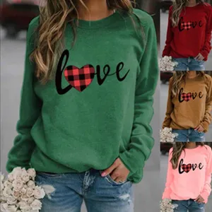 Close-up details of the casual long sleeve sweatshirt featuring a love heart print design.