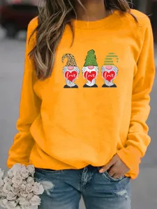 Detailed closeup view of the orange casual pullover sweatshirt with lovely gnome graphics.