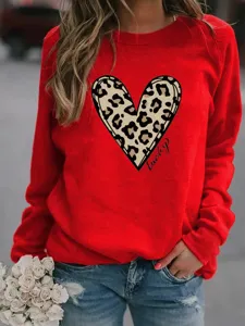 Red crewneck long sleeve sweatshirt featuring leopard heart graphic for casual wear.