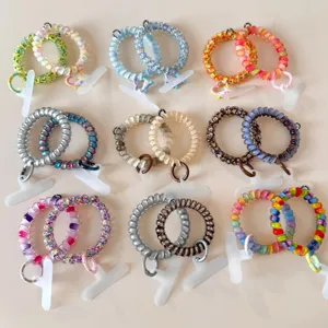 Colorful spiral telephone cord hair ties, gradient candy hair ropes and phone lanyards for women.