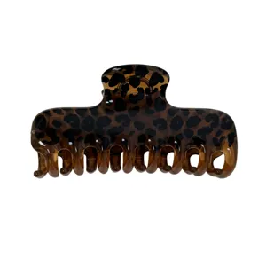Molla per capelli leopardata marrone da donna, grande fermaglio elegante, accessorio chic.