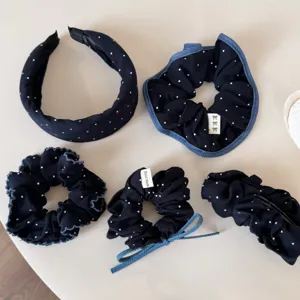 Koreaans donkerblauw stippen haaraccessoires set inclusief haarelastiekjes en haarband.