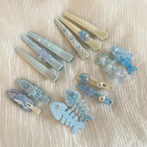 Cute blue marine hair clips set, adorable resin dolphin starfish duckbill pins for girls daily wear.