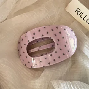 Detailed close-up of the Korean style star print purple acetate hair claw clip accessory.
