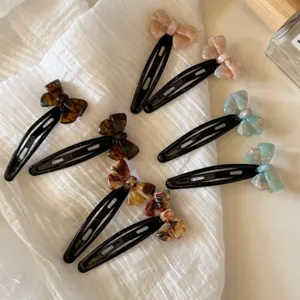 Pinzas de pelo de acetato con lazo coreano vista detallada clips laterales estilo dulce.