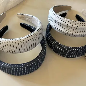 Chic black and white polka dot headbands detail, stylish cloth hair accessories for daily wear.
