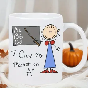 White ceramic coffee mug featuring funny teacher A plus design, perfect appreciation gift cup.