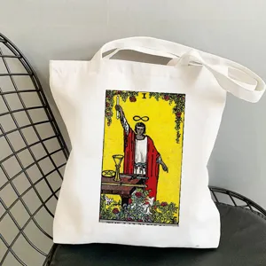 White canvas tote bag featuring a vintage tarot card print, casual shoulder shopping bag.