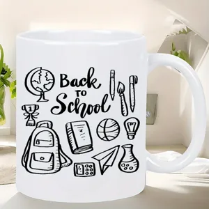 White ceramic coffee mug featuring back to school sketch design and detailed view.