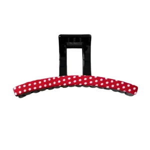 Cute red and white polka dot hair claw clip for women, stylish fabric wrapped hair accessory.