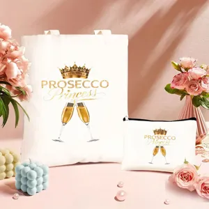 Nahaufnahme der Stofftasche und Kosmetiktasche mit goldenem Prosecco-Kronen-Druck.