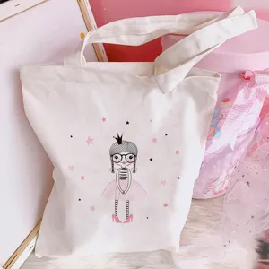 Canvas tote bag detail featuring a cute cartoon ballet girl print in pink and white style.